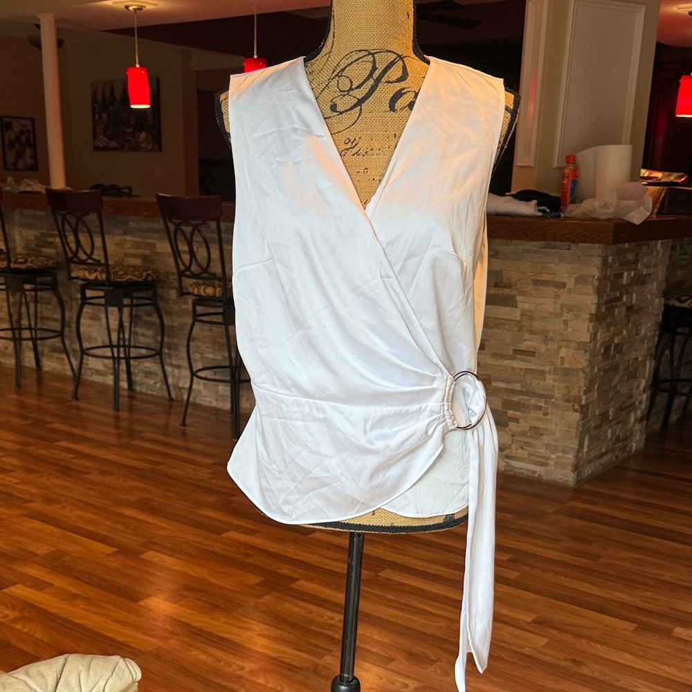INC size large white silky wrap top with large silver circle closure